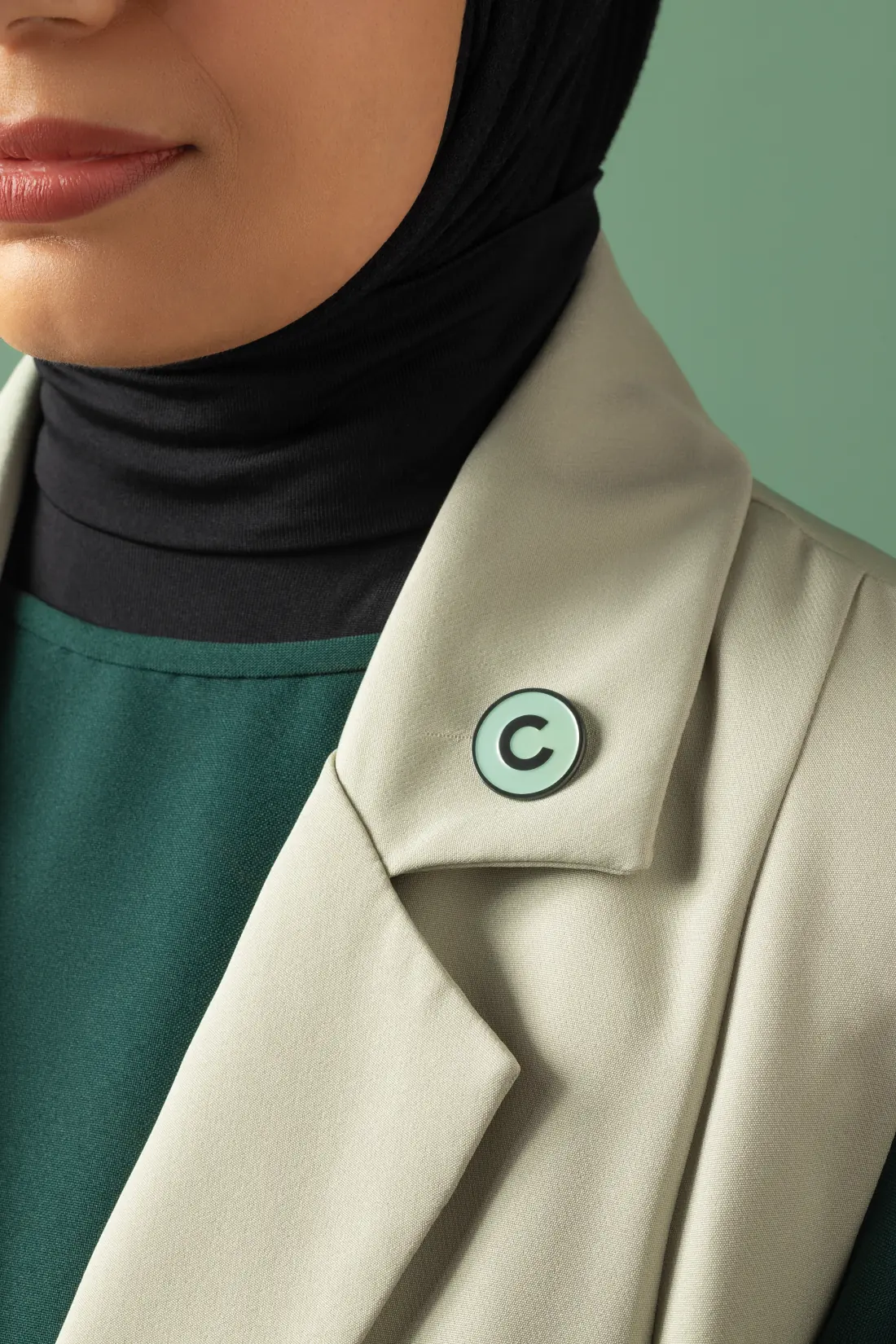 The Creative Lab pin on a jacket lapel