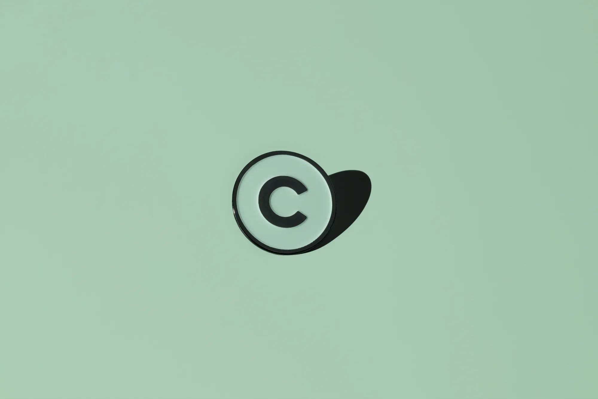 The Creative Lab pin on a green background